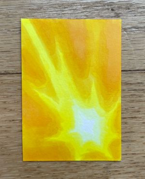 A small artwork of a bright sunburst shape, with a soft gradient from white to golden-yellow.